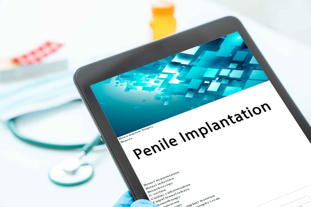 tablet showing penile implantation words.