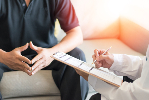 Patient talking with a doctor.