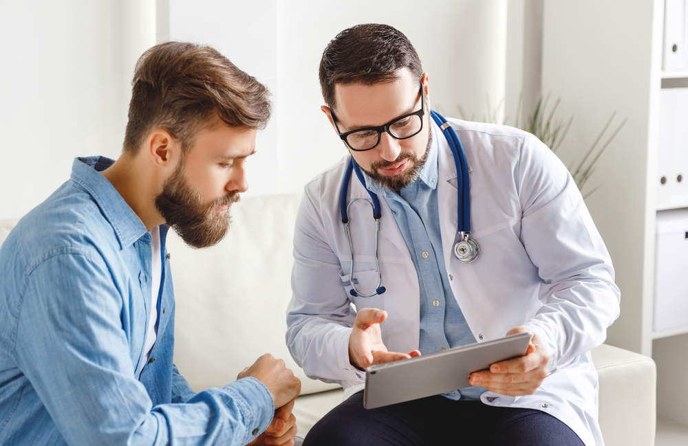 man talking to his doctor.