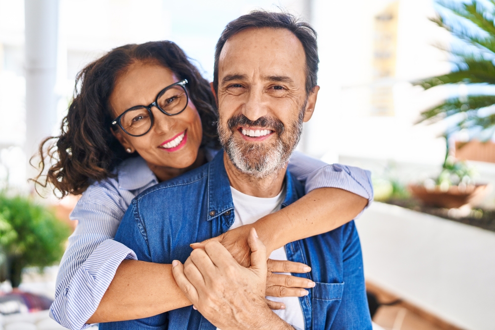 older couple smiling.