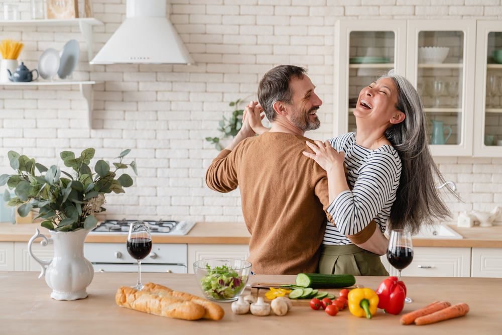 older couple smiling.